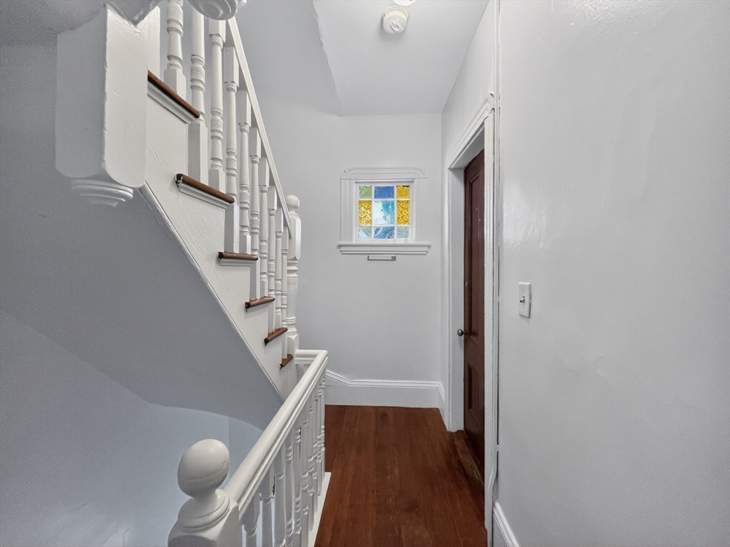 49 Porter Street Somerville, MA 02143 - Photo 14 of 40 a view of entryway and hall with wooden floor
