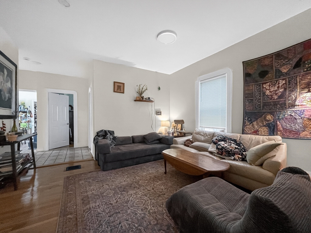 49 Porter Street Somerville, MA 02143 - Photo 2 of 40 a living room with furniture window and wooden floor
