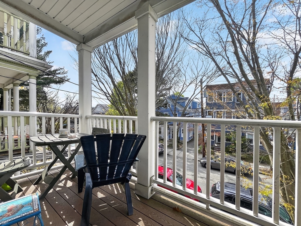 49 Porter Street Somerville, MA 02143 - Photo 31 of 40 a view of a chairs and table in the balcony