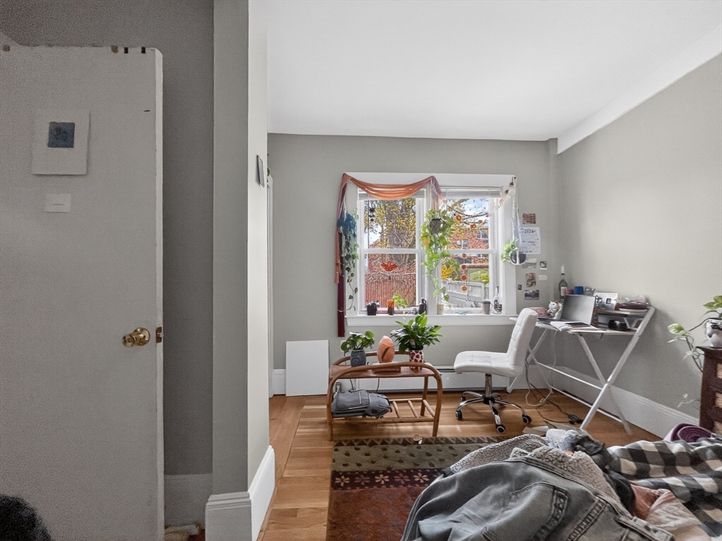 49 Porter Street Somerville, MA 02143 - Photo 9 of 40 a living room with furniture and a window