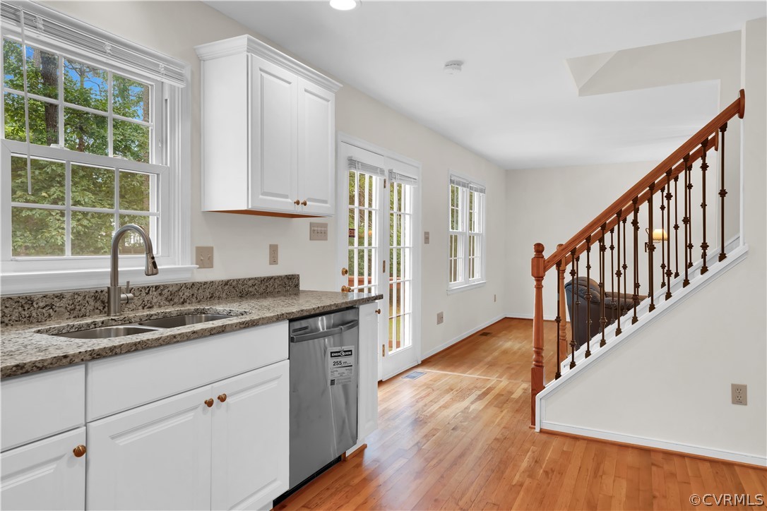7531 Genuine Risk Lane Midlothian, VA 23112 - Photo 16 of 50 a kitchen with wooden floors and a window