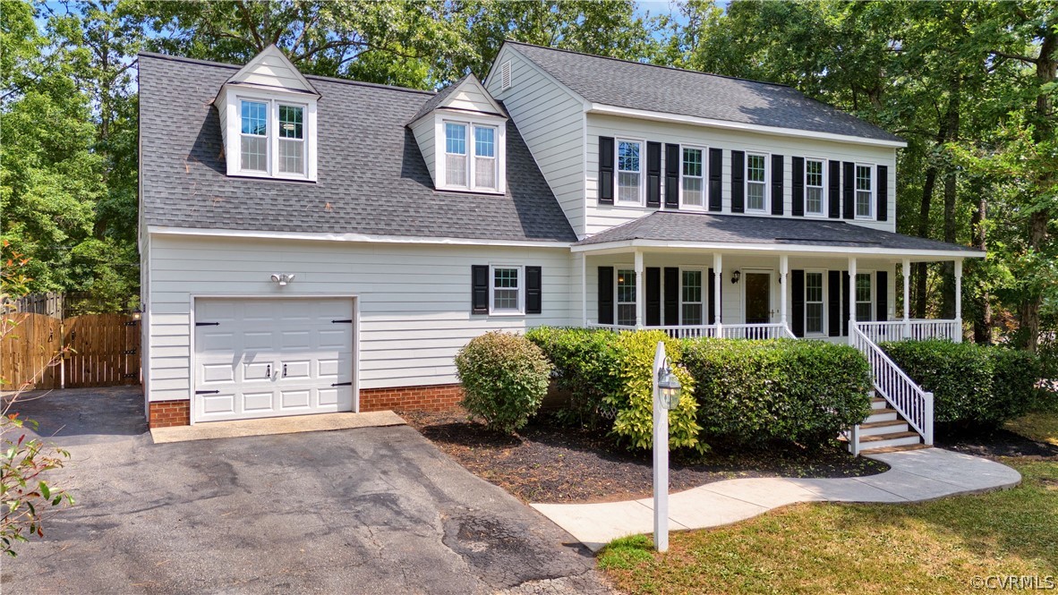 7531 Genuine Risk Lane Midlothian, VA 23112 - Photo 2 of 50 a front view of a house with a garden
