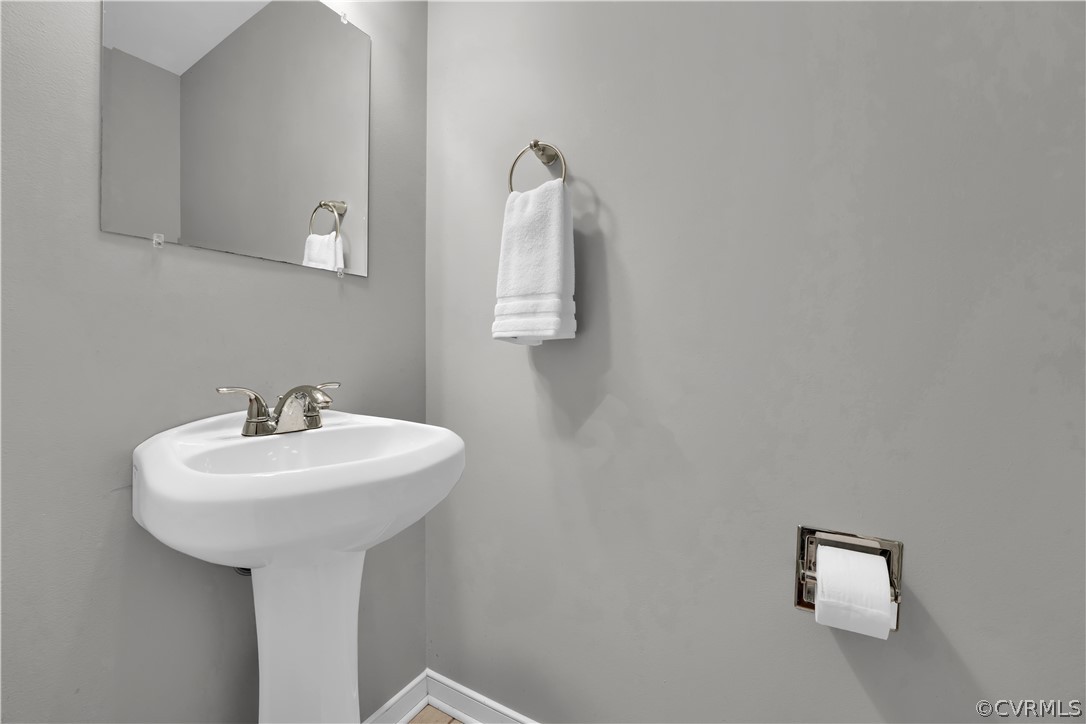 7531 Genuine Risk Lane Midlothian, VA 23112 - Photo 23 of 50 a bathroom with a sink and mirror