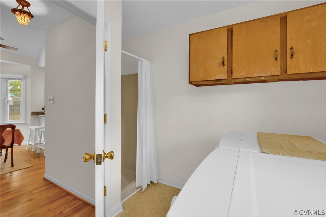 7531 Genuine Risk Lane Midlothian, VA 23112 - Photo 24 of 50 a view of a bedroom with wooden floor and cabinet