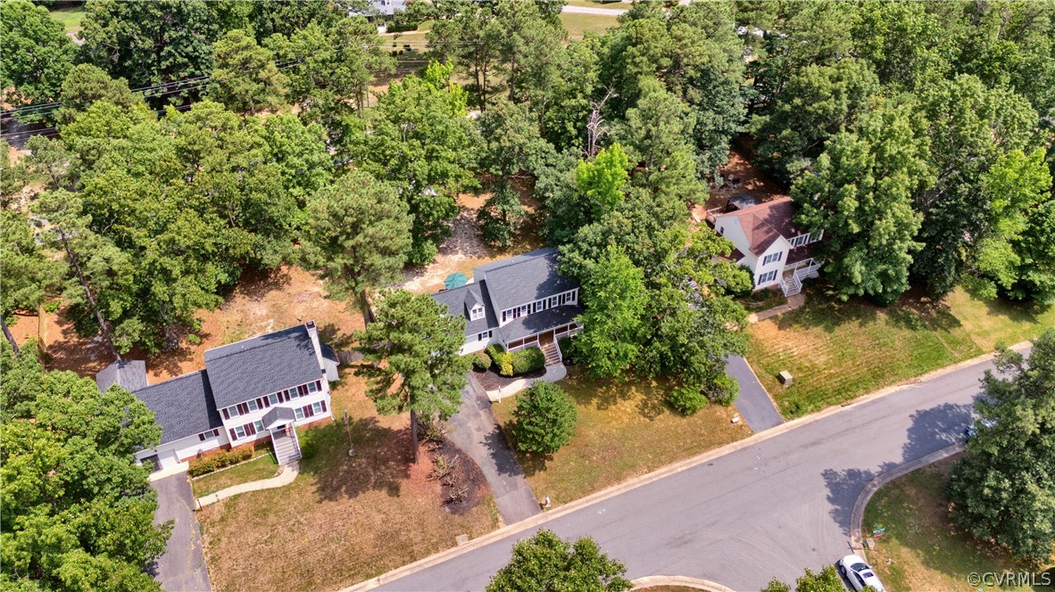 7531 Genuine Risk Lane Midlothian, VA 23112 - Photo 3 of 50 an aerial view of house with yard swimming pool and outdoor seating