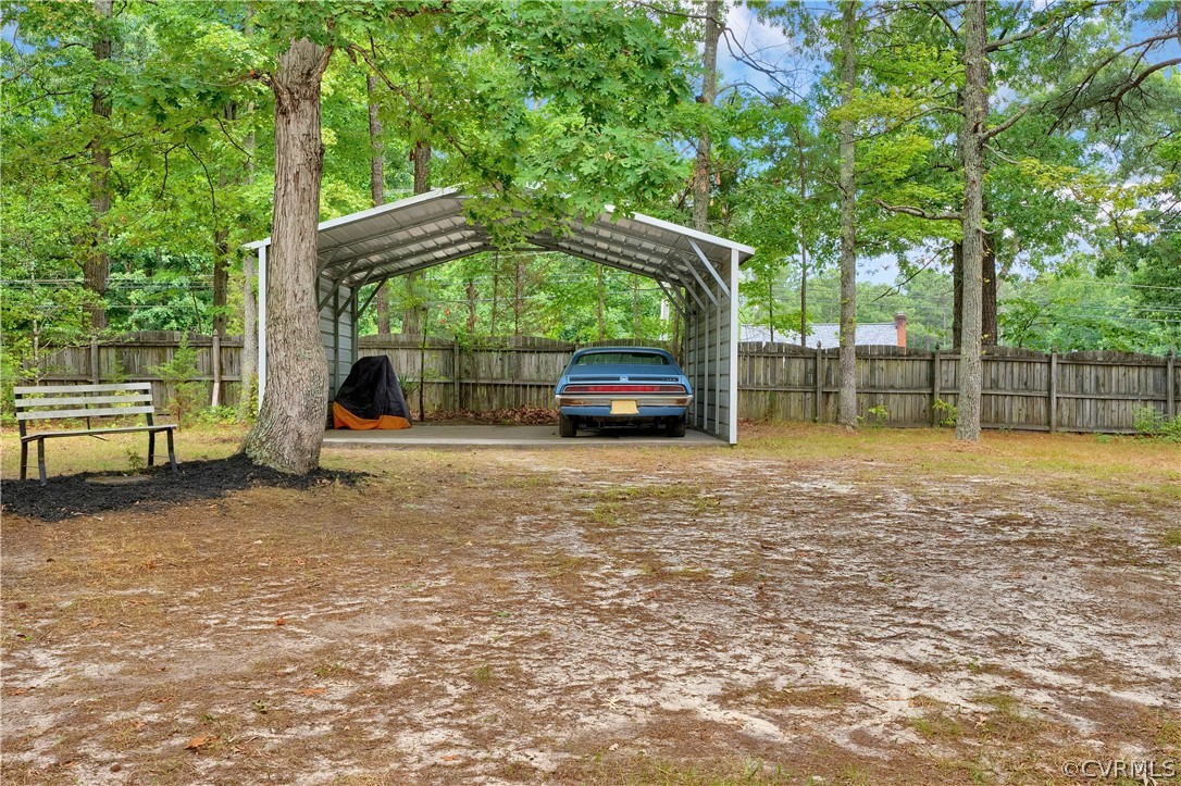 7531 Genuine Risk Lane Midlothian, VA 23112 - Photo 45 of 50 a view of a tree in the middle of a yard