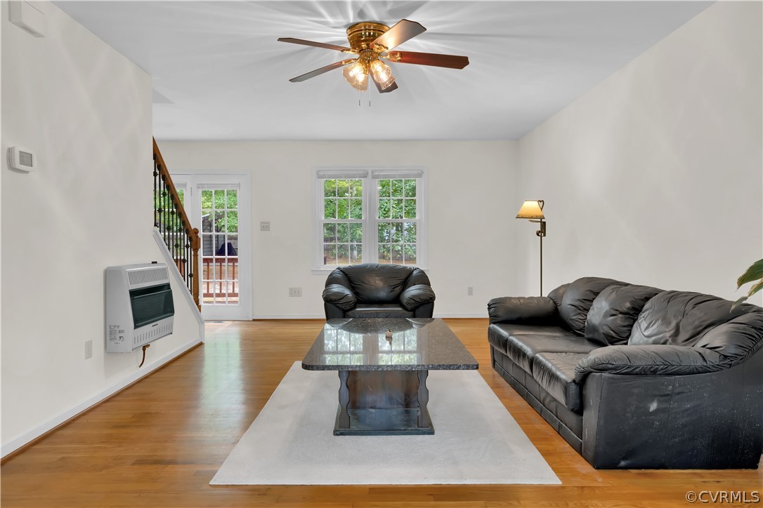 7531 Genuine Risk Lane Midlothian, VA 23112 - Photo 5 of 50 a living room with furniture and a fireplace