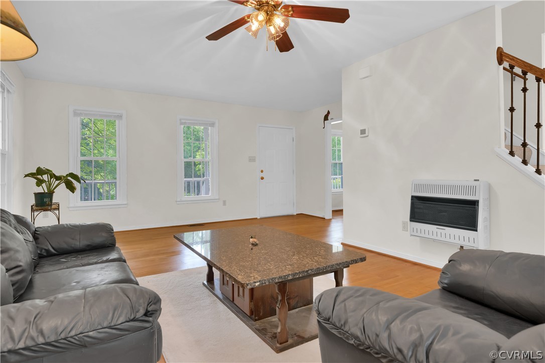 7531 Genuine Risk Lane Midlothian, VA 23112 - Photo 7 of 50 a living room with furniture and a flat screen tv