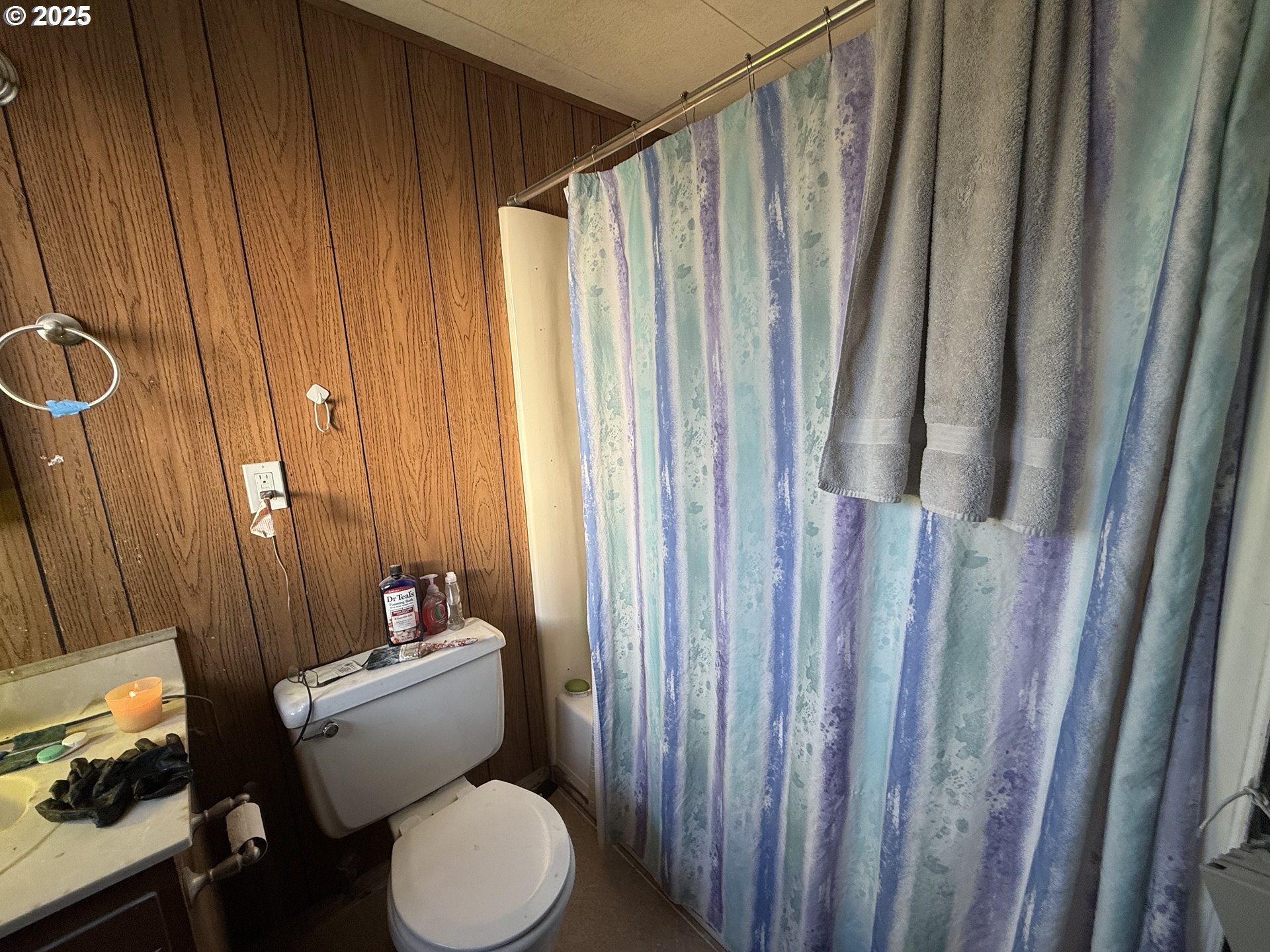 260 North 13th Street Elgin, OR 97827 - Photo 11 of 13 a white toilet sitting next to a small yard