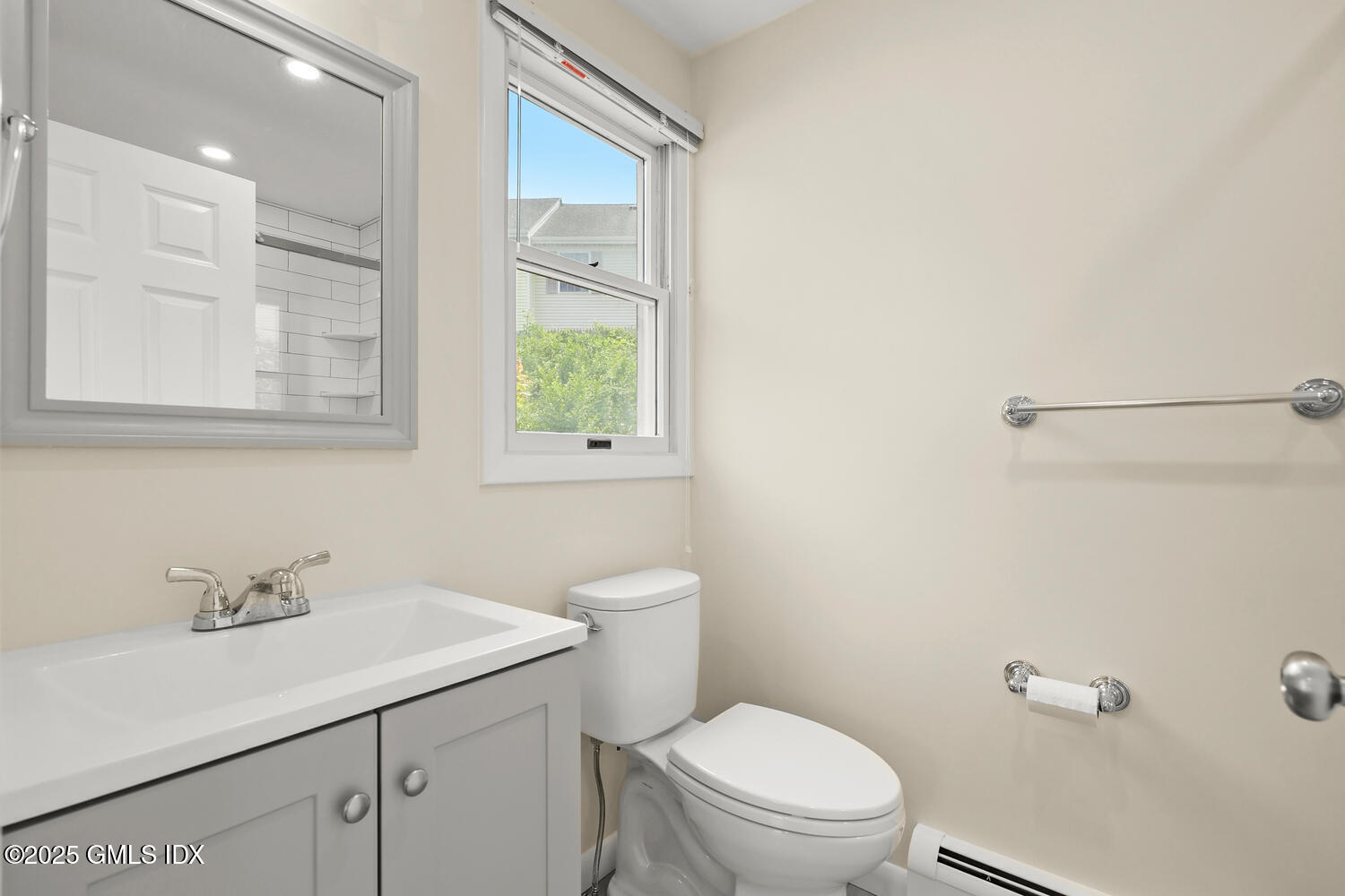 248 Byram Road, Unit L Greenwich, CT 06830 - Photo 13 of 17 a bathroom with a sink a toilet and with mirror