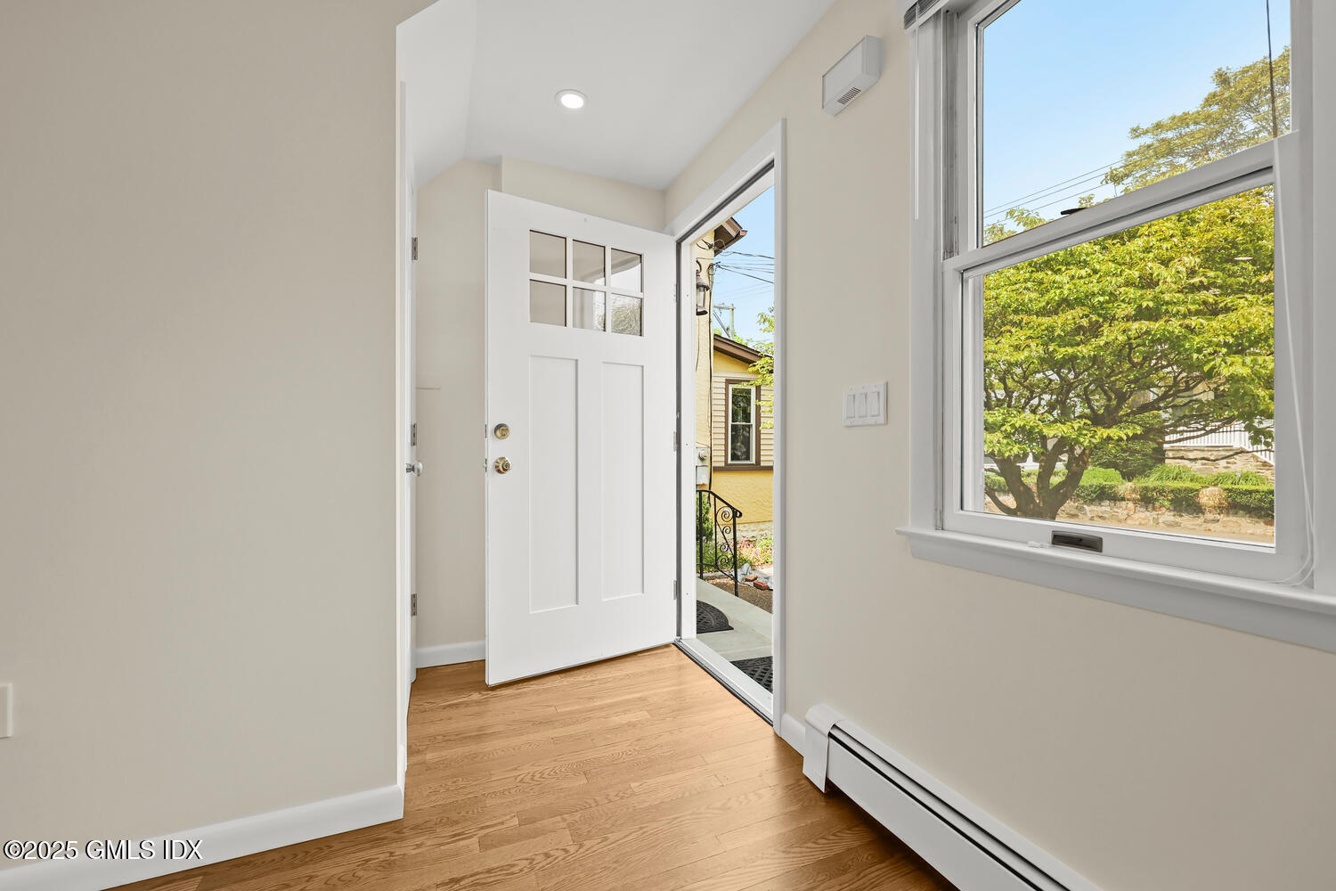 248 Byram Road, Unit L Greenwich, CT 06830 - Photo 2 of 17 an empty room with windows