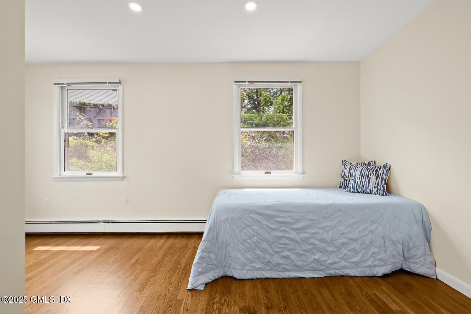 248 Byram Road, Unit L Greenwich, CT 06830 - Photo 10 of 17 a bedroom with a bed and a window