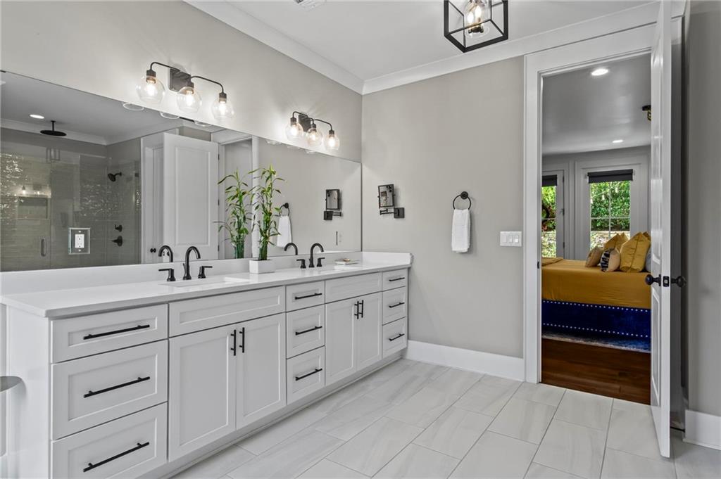 53 Maple Street Roswell, GA 30075 - Photo 19 of 59 a en suite bathroom with double sink and a large mirror