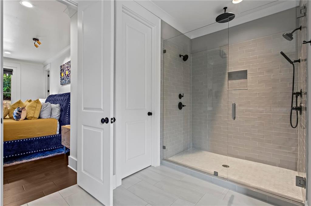 53 Maple Street Roswell, GA 30075 - Photo 21 of 59 a bathroom with a tub and shower