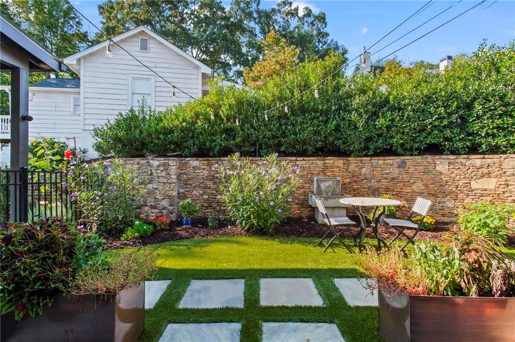 53 Maple Street Roswell, GA 30075 - Photo 36 of 59 a view of a chair and table in the garden