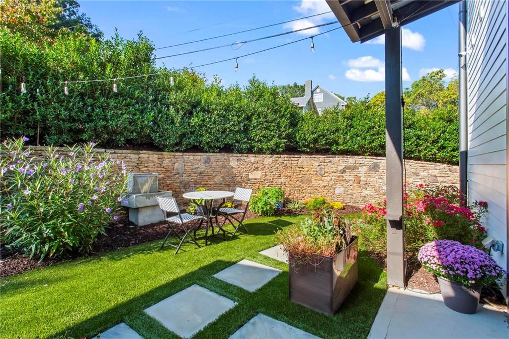 53 Maple Street Roswell, GA 30075 - Photo 37 of 59 a view of a chair and tables in the garden
