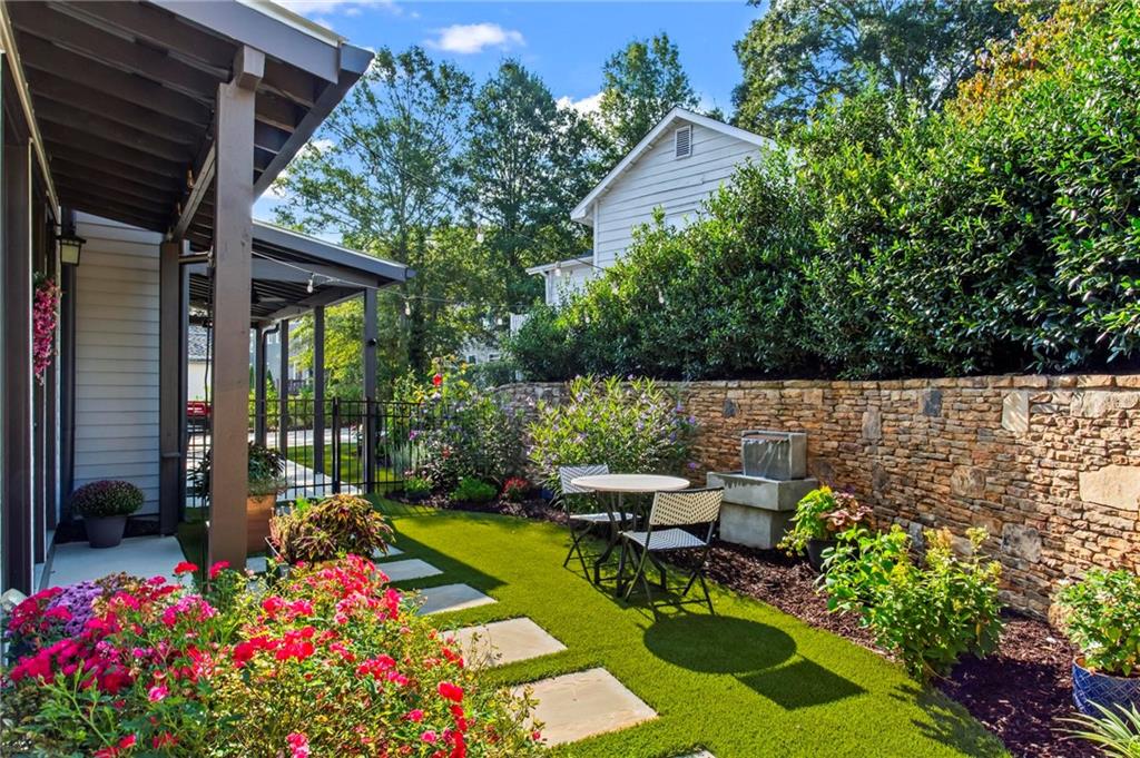 53 Maple Street Roswell, GA 30075 - Photo 39 of 59 a view of a patio with chairs potted plants and large tree