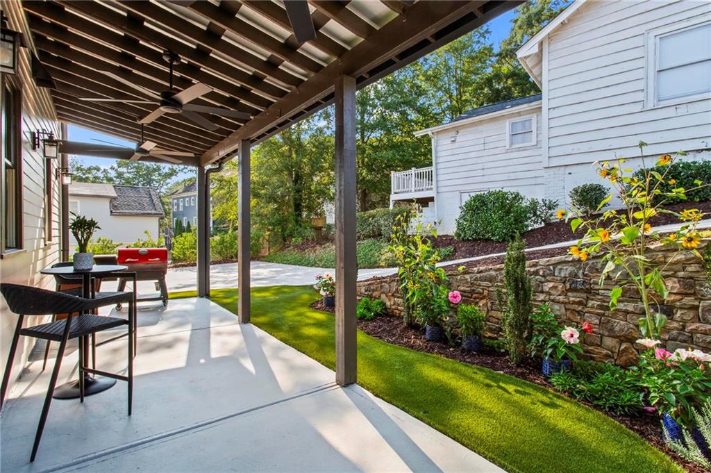 53 Maple Street Roswell, GA 30075 - Photo 41 of 59 a view of a porch with furniture and garden
