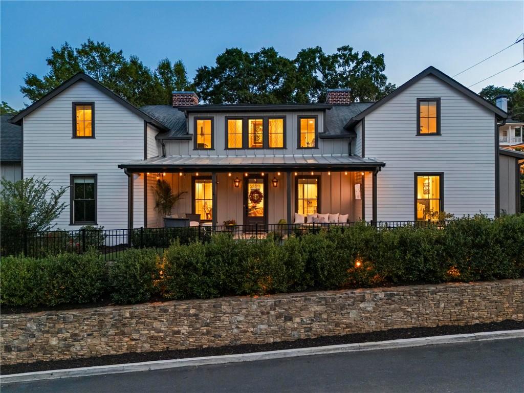 53 Maple Street Roswell, GA 30075 - Photo 44 of 59 a front view of a house with a yard and garage