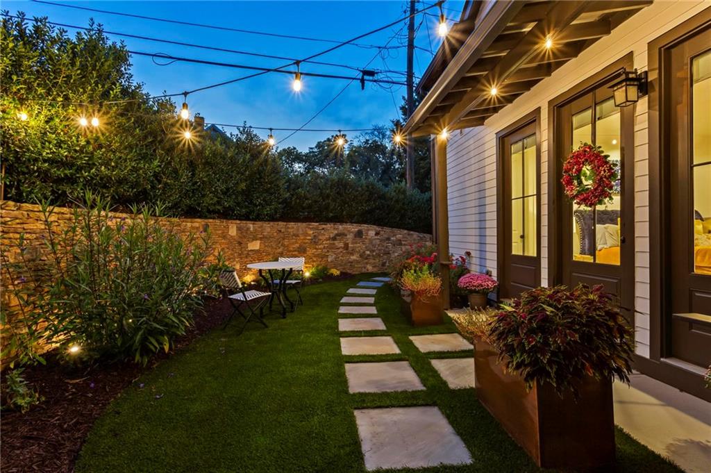 53 Maple Street Roswell, GA 30075 - Photo 48 of 59 a view of a patio with table and chairs and potted plants