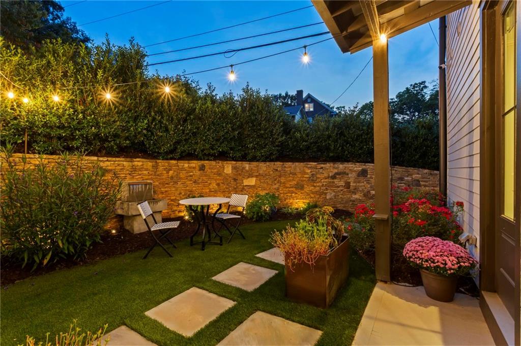 53 Maple Street Roswell, GA 30075 - Photo 49 of 59 a view of a patio with table and chairs and potted plants
