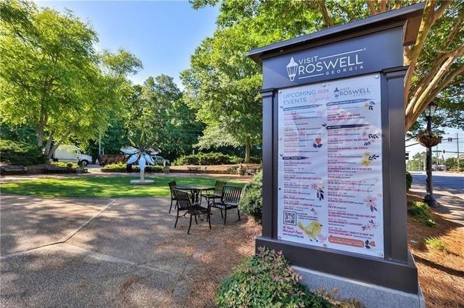 53 Maple Street Roswell, GA 30075 - Photo 55 of 59 a view of a chairs and table in the back yard of the house