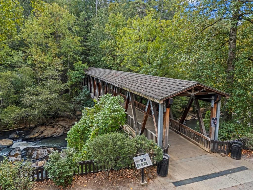 53 Maple Street Roswell, GA 30075 - Photo 57 of 59 a house with lots of trees in front of it