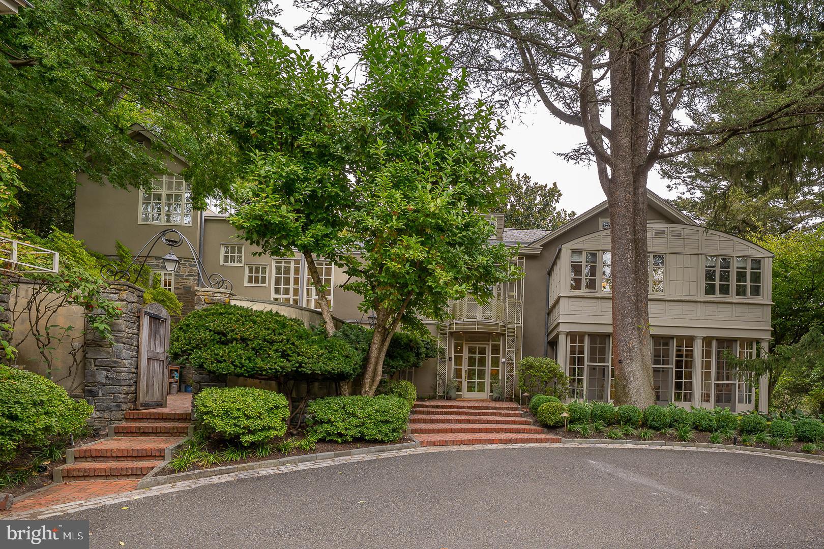 front view of a house with a garden
