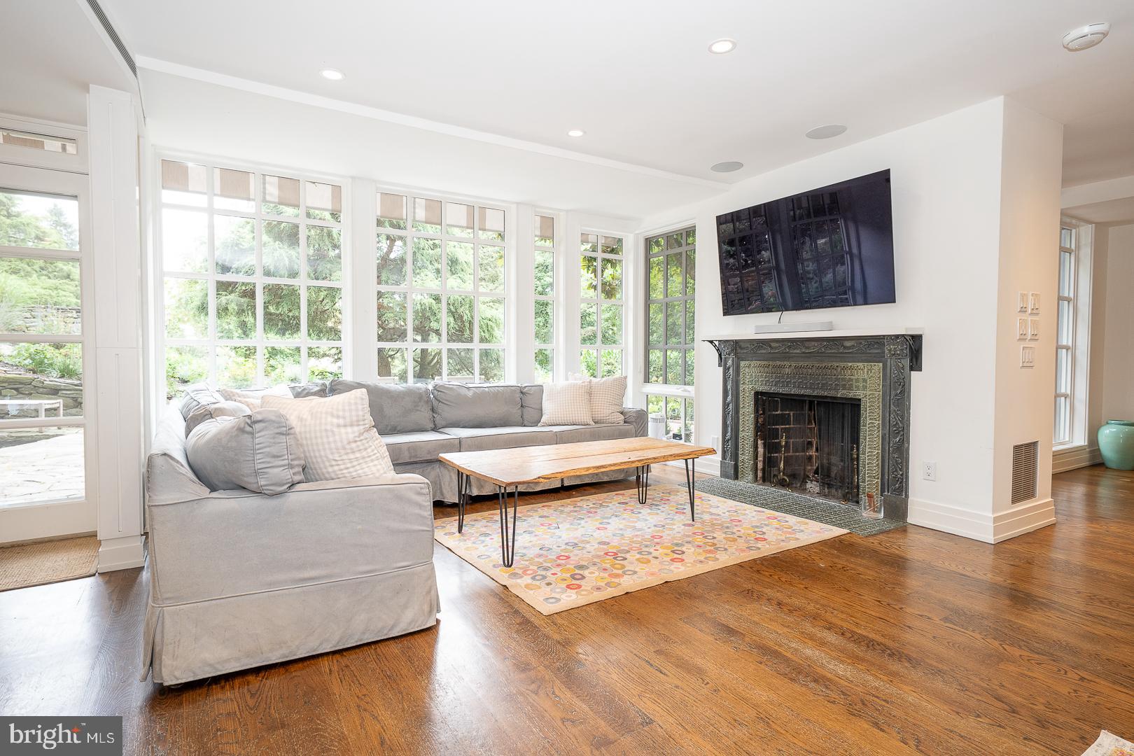 15 Old Gulph Road Gladwyne, PA 19035 - Photo 14 of 66 a living room with furniture and a fireplace