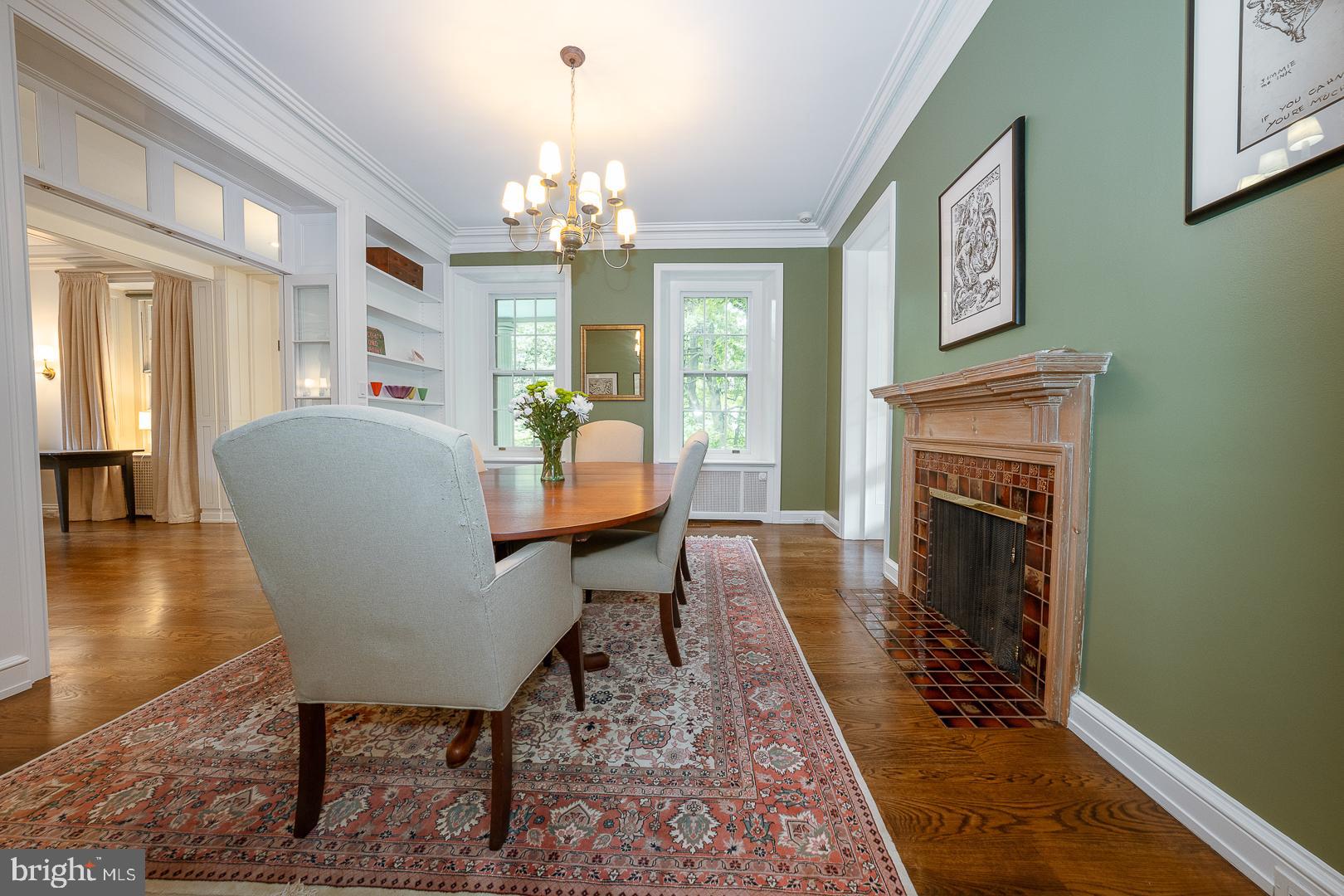 15 Old Gulph Road Gladwyne, PA 19035 - Photo 17 of 66 a living room with furniture a chandelier and a fireplace