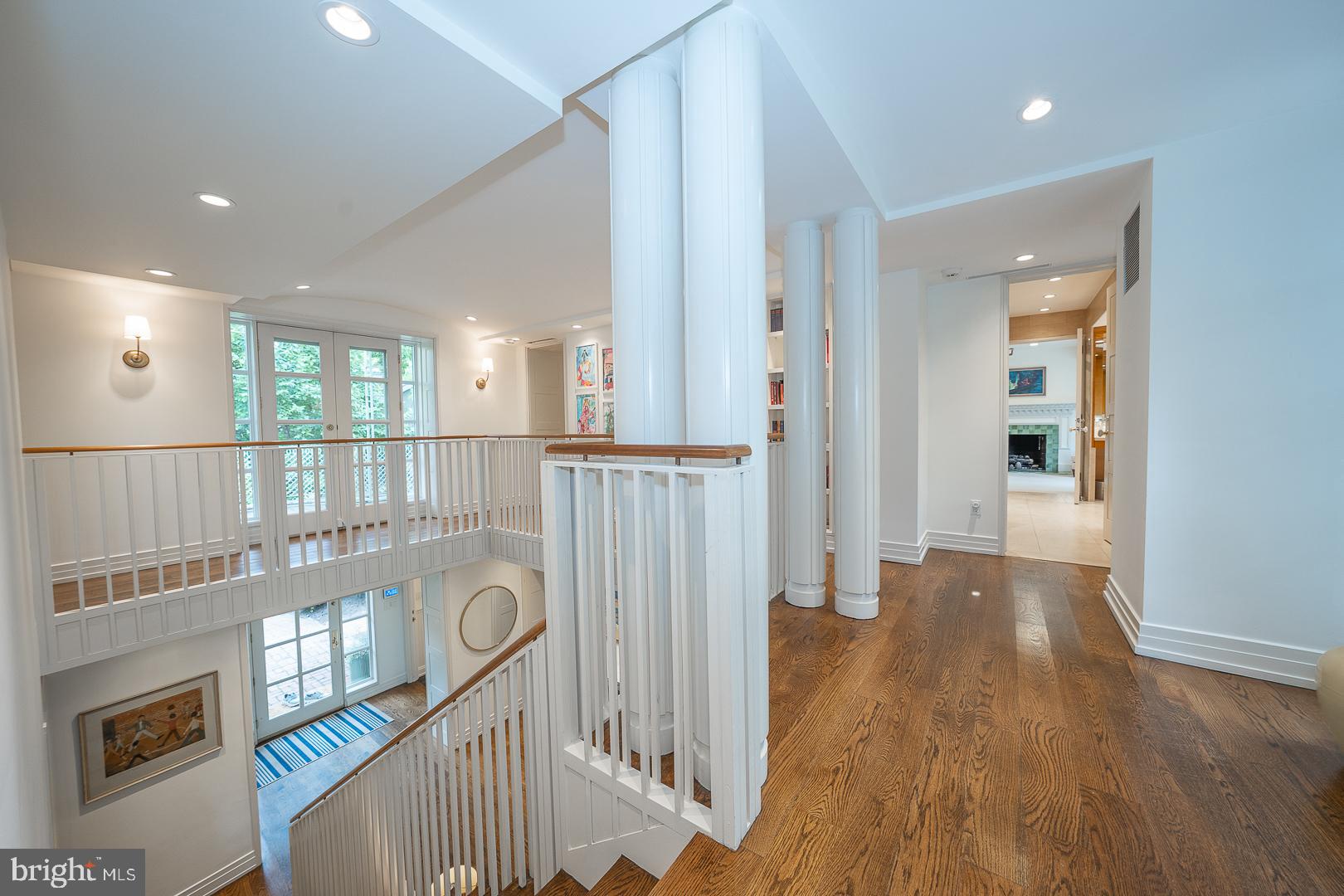 15 Old Gulph Road Gladwyne, PA 19035 - Photo 23 of 66 a view of a hallway with wooden floor and stairs