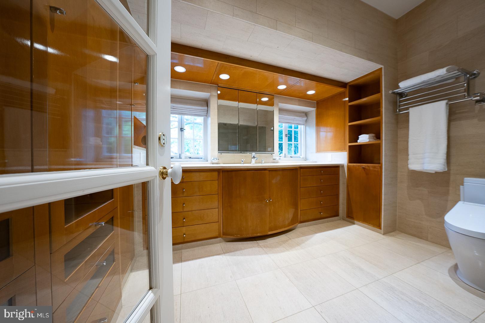 15 Old Gulph Road Gladwyne, PA 19035 - Photo 28 of 66 a bathroom with a sink a toilet and shower