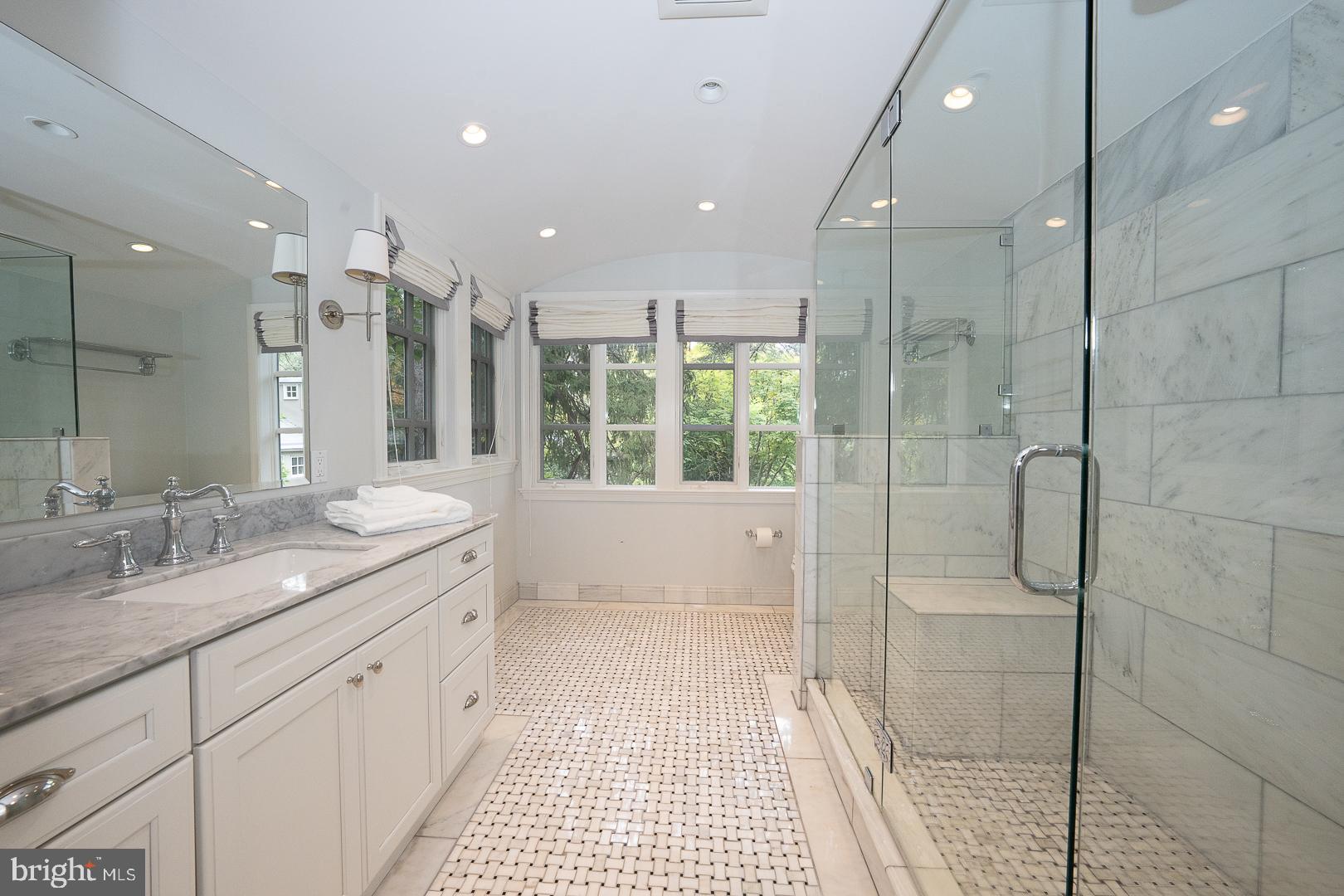 15 Old Gulph Road Gladwyne, PA 19035 - Photo 34 of 66 a bathroom with a granite countertop sink a toilet a large mirror and shower