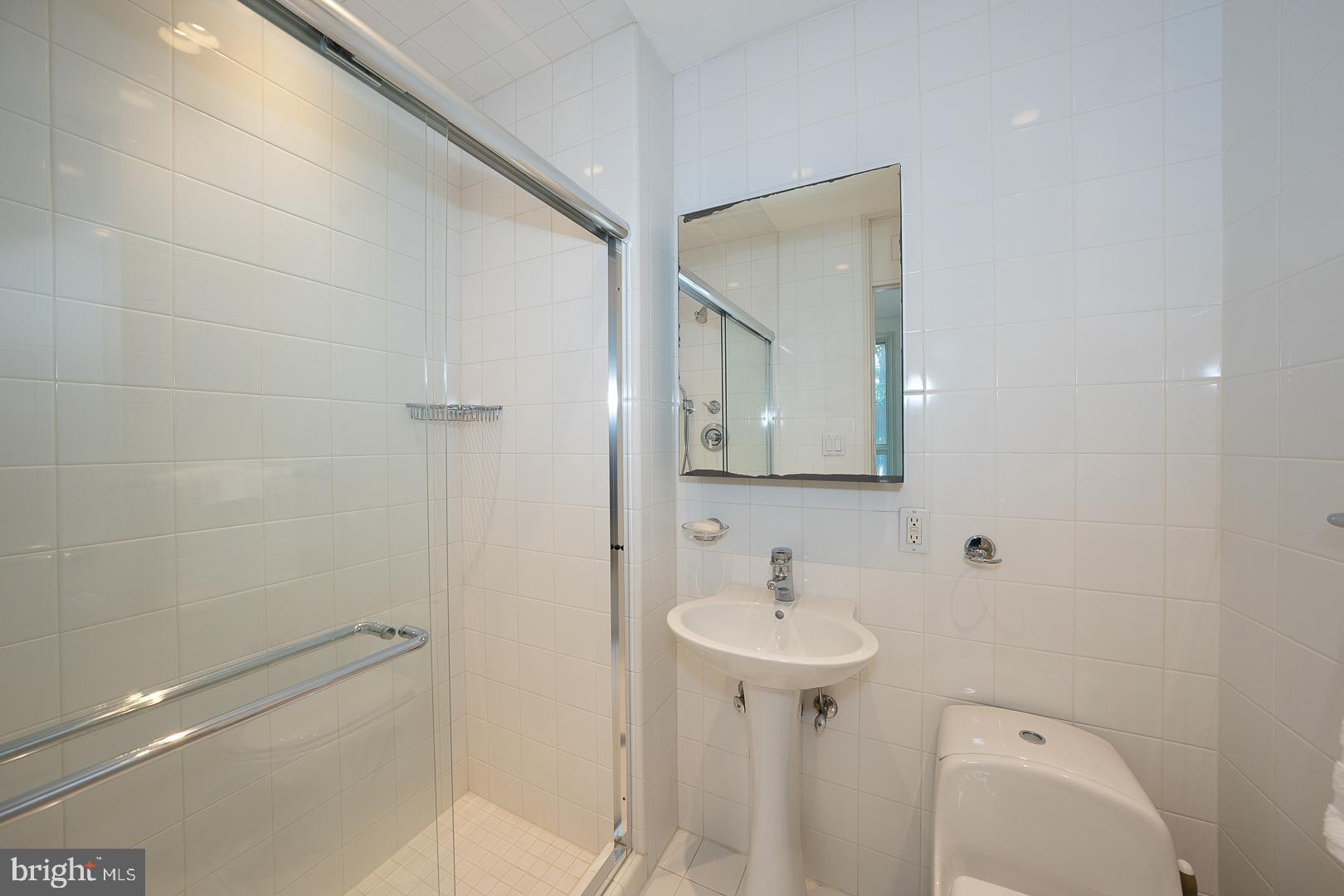 15 Old Gulph Road Gladwyne, PA 19035 - Photo 47 of 66 a bathroom with a sink a toilet and shower