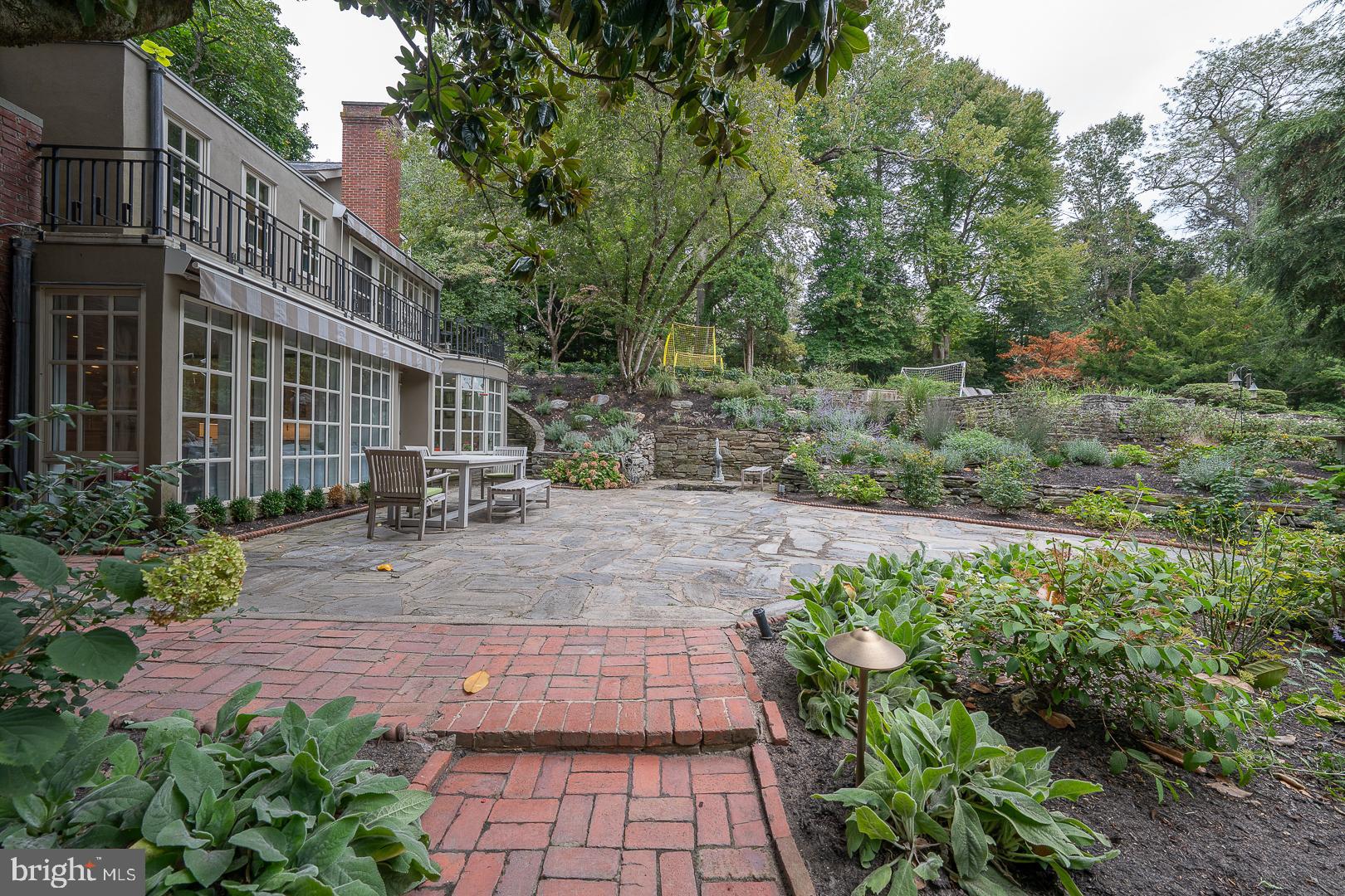 15 Old Gulph Road Gladwyne, PA 19035 - Photo 59 of 66 a view of a pathway with flower plants