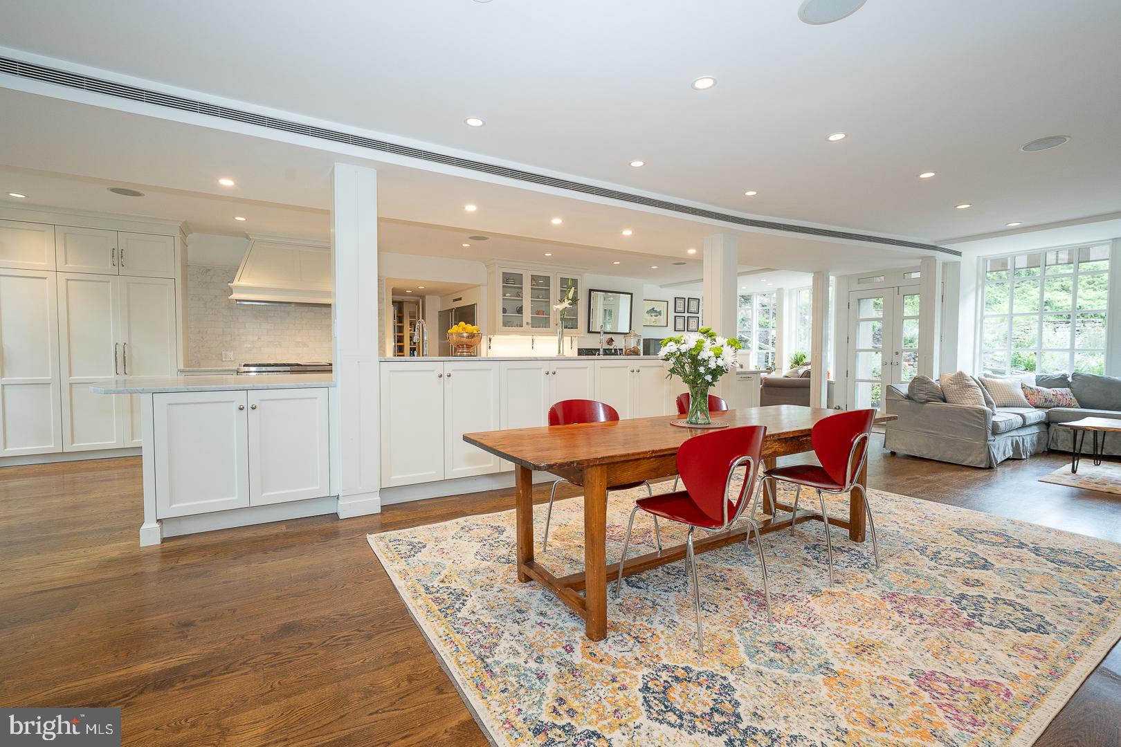 15 Old Gulph Road Gladwyne, PA 19035 - Photo 8 of 66 a living room with furniture a dining table and kitchen view with wooden floor