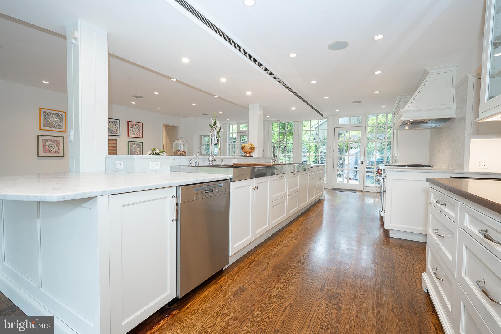 15 Old Gulph Road Gladwyne, PA 19035 - Photo 9 of 66 a kitchen with a sink wooden floor stainless steel appliances and cabinets