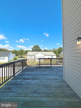 a view of outside space with wooden floor and city view