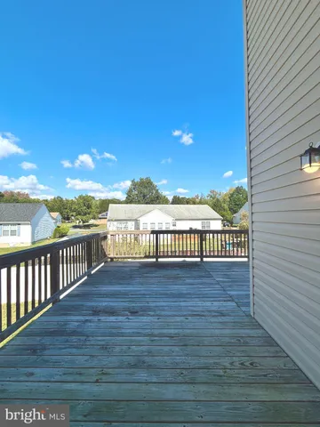 a view of outside space with wooden floor and city view