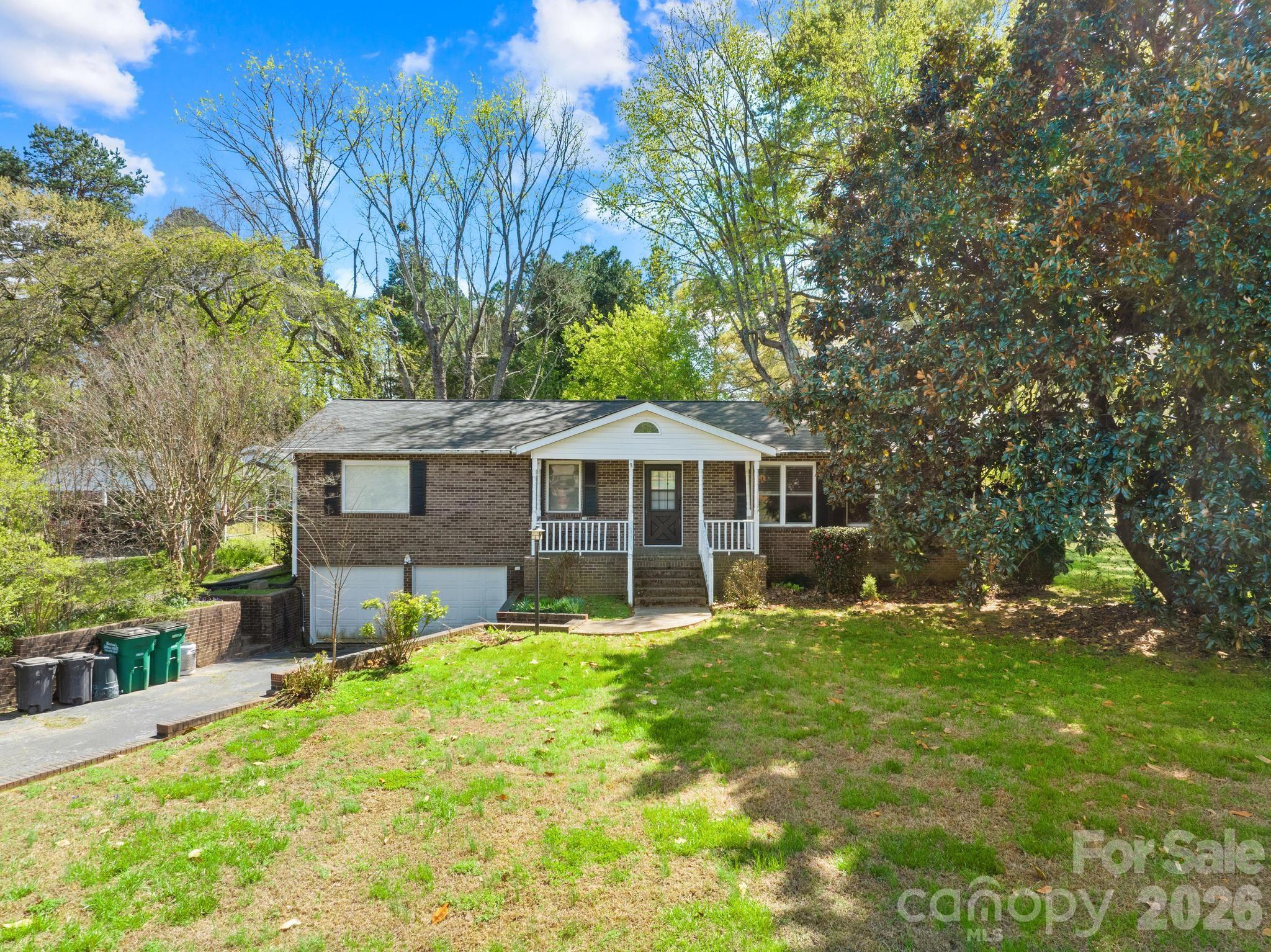 a view of a house with a yard