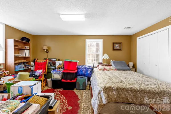 a kitchen with stainless steel appliances granite countertop a refrigerator a stove and a sink