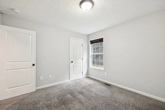 a view of a hallway with closet