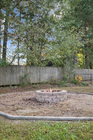 an aerial view of a house with swimming pool and lake view