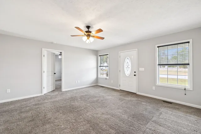 a view of an empty room with a window
