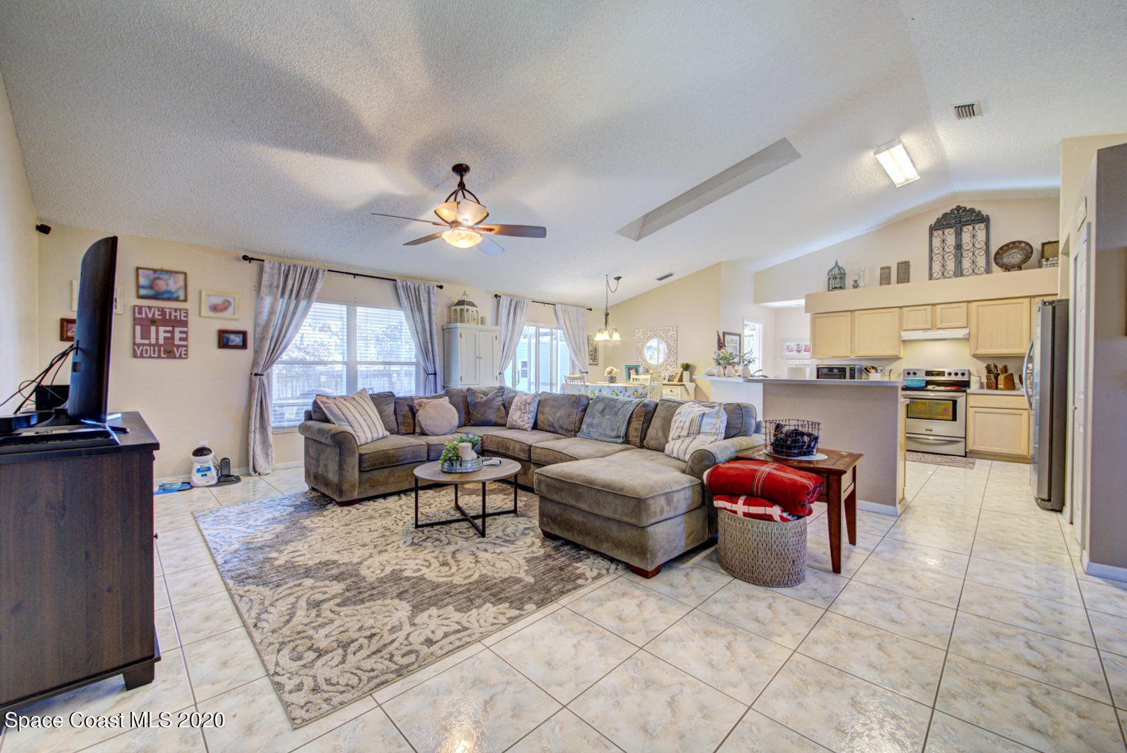 4359 Eastman Street Cocoa, FL 32927 - Photo 14 of 52 a living room with furniture and a flat screen tv