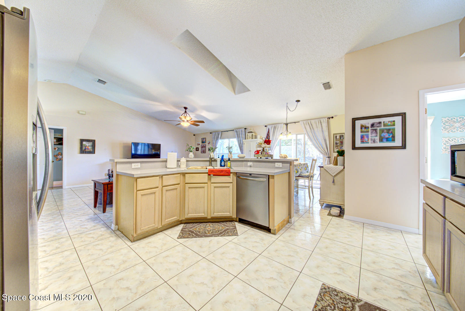 4359 Eastman Street Cocoa, FL 32927 - Photo 19 of 52 a kitchen with a sink a stove top oven and cabinets