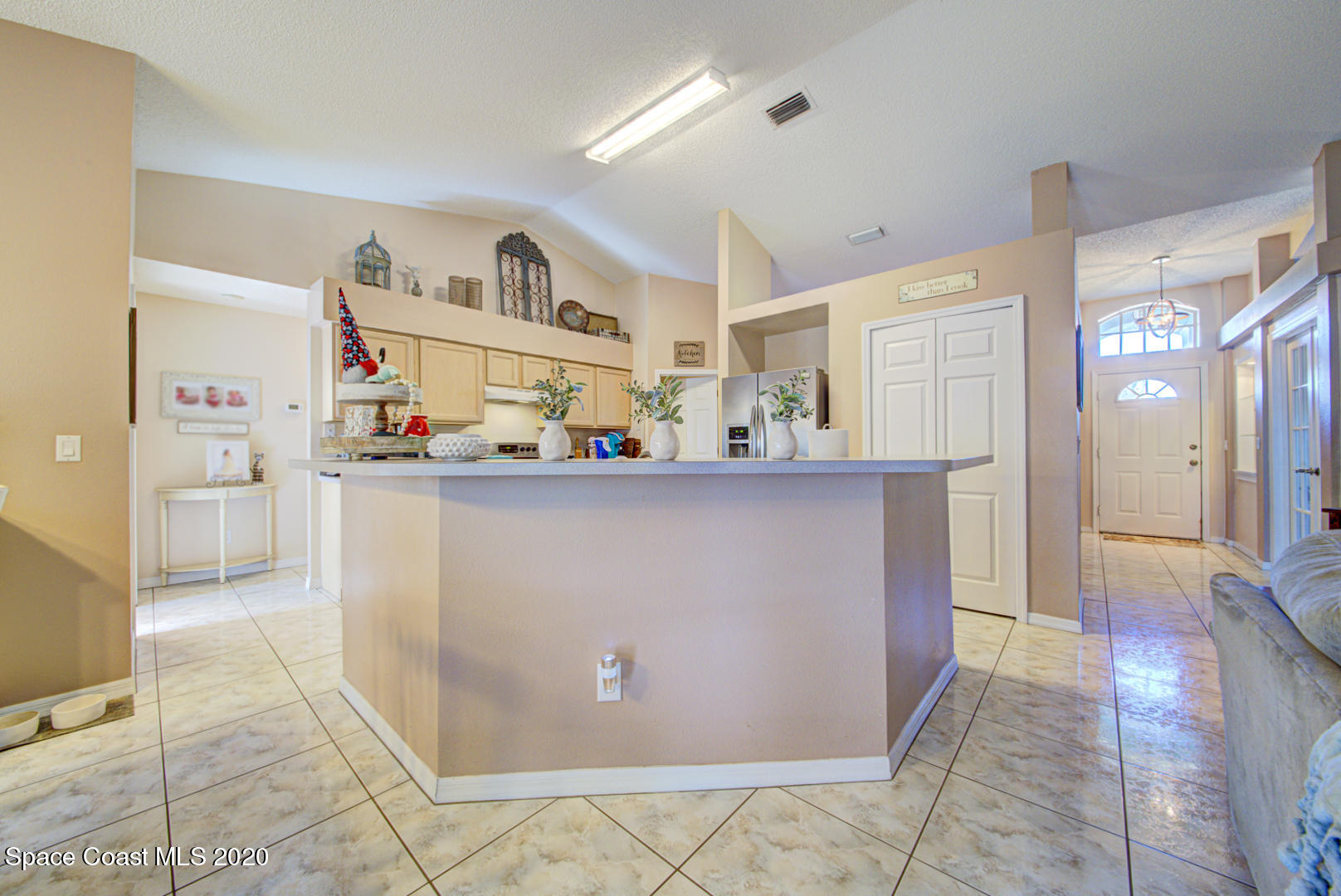 4359 Eastman Street Cocoa, FL 32927 - Photo 21 of 52 a living room with granite countertop furniture and a kitchen view