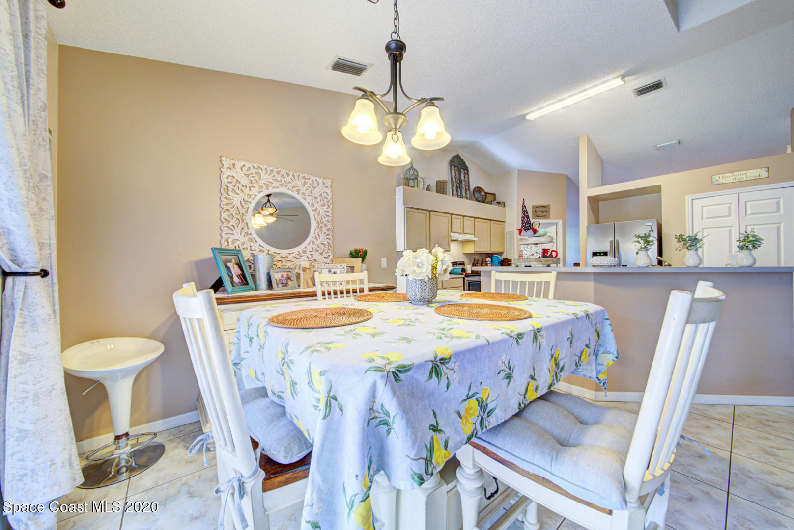4359 Eastman Street Cocoa, FL 32927 - Photo 23 of 52 a dining room with furniture and chandelier