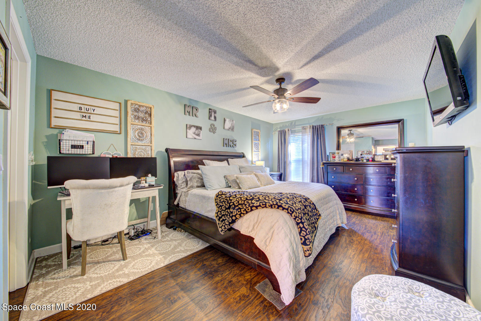 4359 Eastman Street Cocoa, FL 32927 - Photo 26 of 52 a bedroom with a bed a couch and dresser
