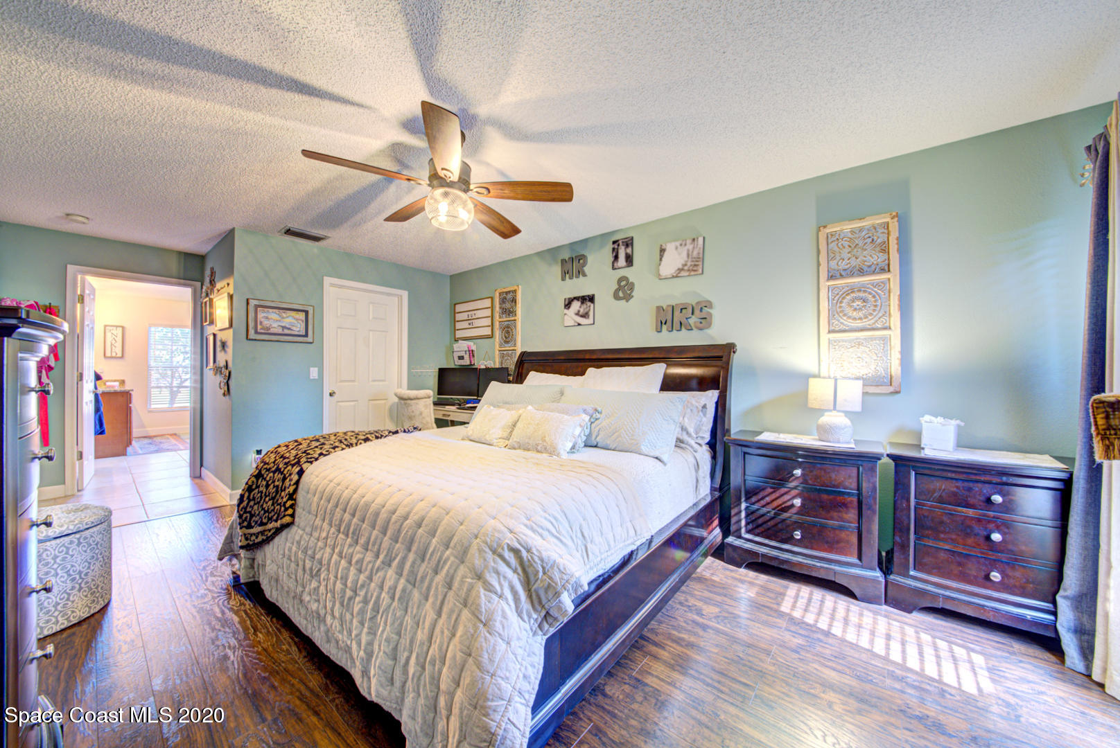 4359 Eastman Street Cocoa, FL 32927 - Photo 27 of 52 a bedroom with a bed and wooden floor